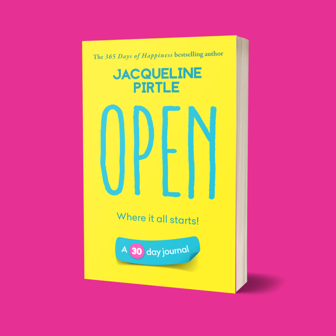 A bright yellow journal with the title 'Open – Where It All Starts' in blue text, indicating a 30-day journaling commitment by Jacqueline Pirtle from her Life-changing Journal Series