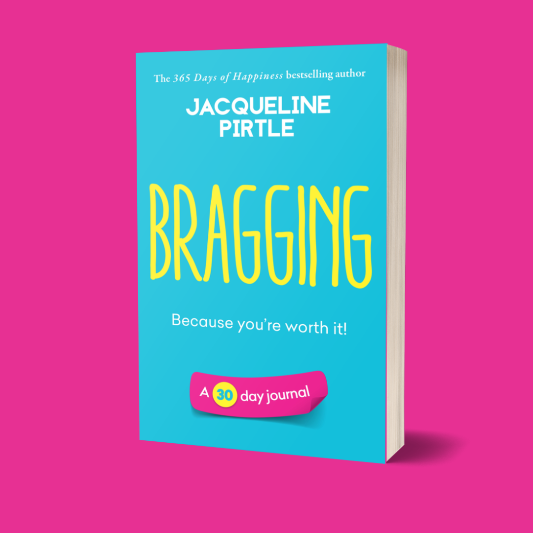 A book cover with the title 'Bragging – Because You’re Worth It' by Jacqueline Pirtle. The cover is predominantly blue with yellow text and a pink badge that reads 'A 30-day journal'.