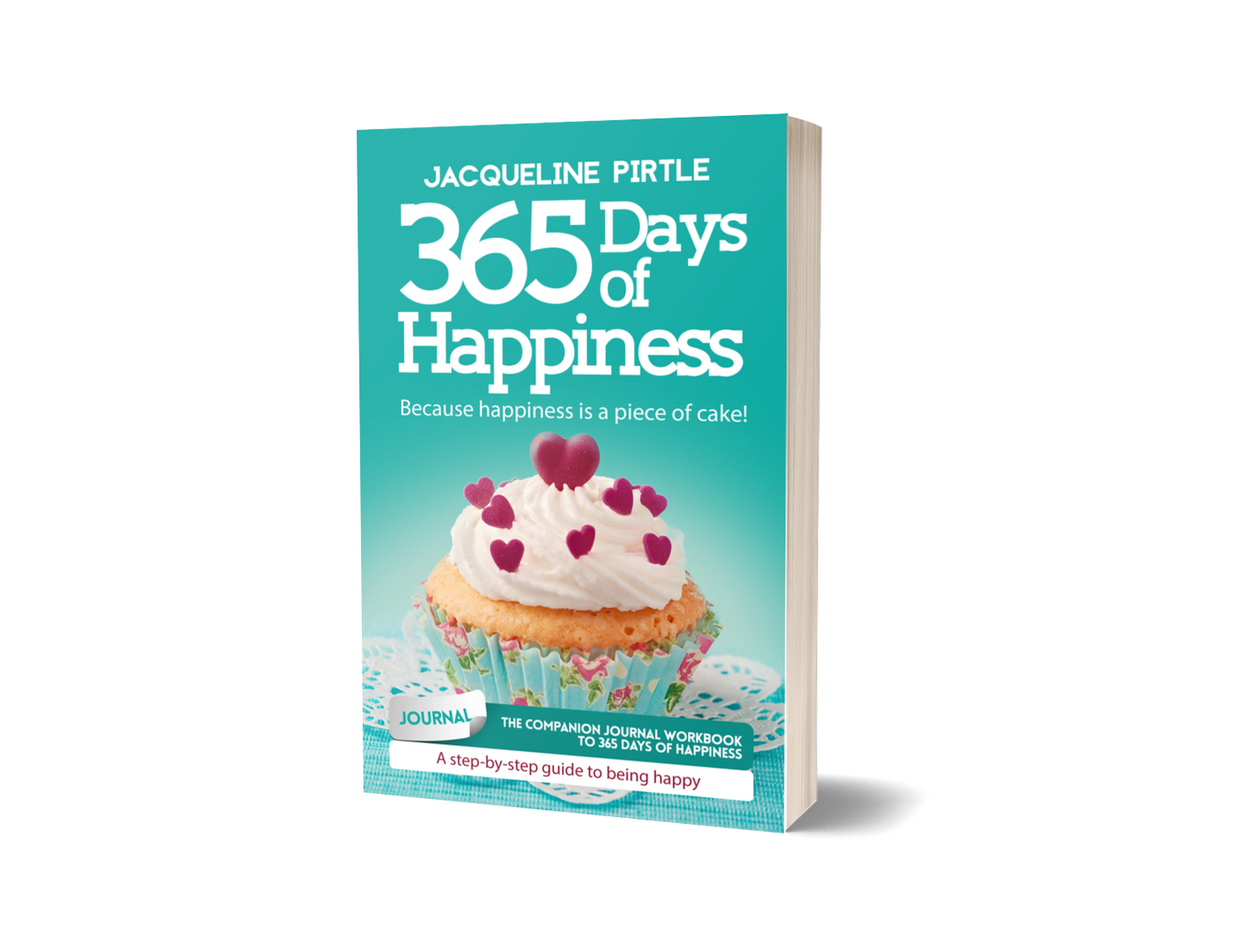 A paperback copy of '365 Days of Happiness' the companion journal workbook by Jacqueline Pirtle, featuring a cupcake with hearts on the frosting on a green-blue background.