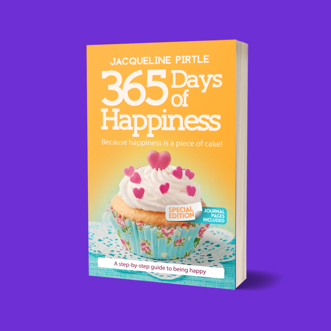 A special edition paperback book titled '365 Days of Happiness' with room for notes, by Jacqueline Pirtle, featuring a cupcake with a heart on the top, set against a purple background.