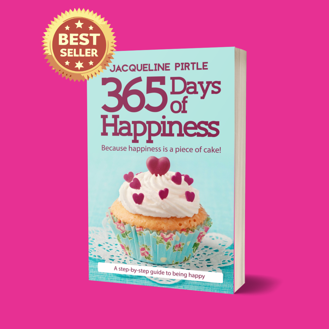 A paperback book titled '365 Days of Happiness' by Jacqueline Pirtle, depicting a cupcake with hearts on the icing on a pink background, with a 'Best Seller' badge at the top.