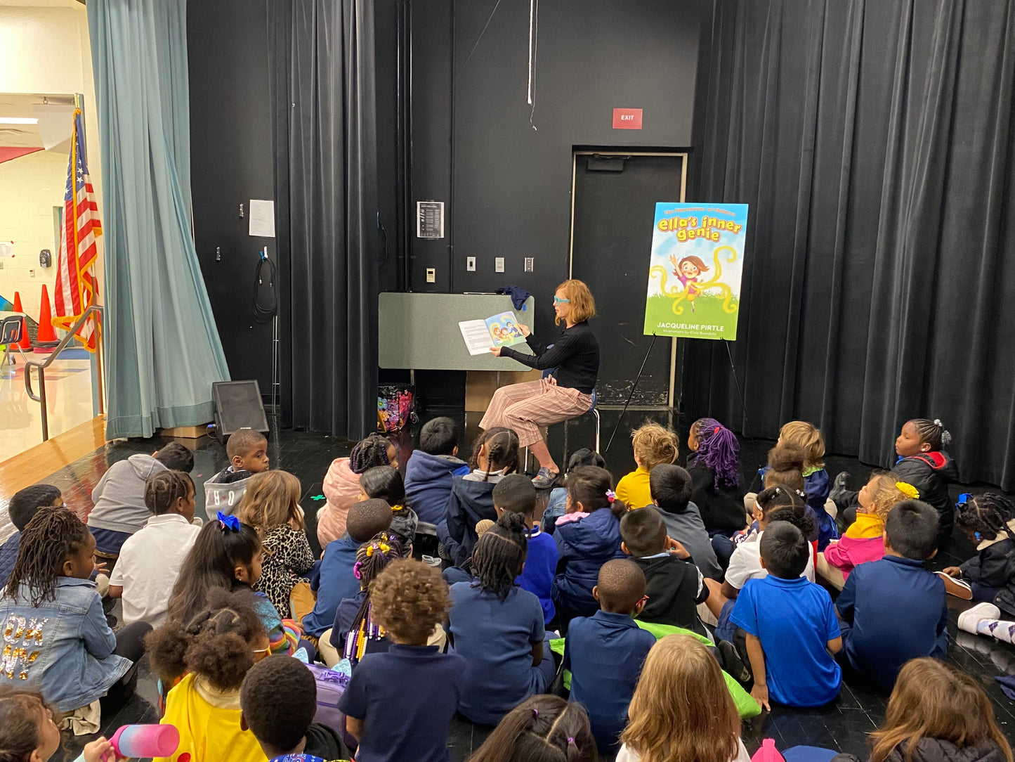 Author Jacqueline Pirtle reading her book Ella's Inner Genie to children at a school