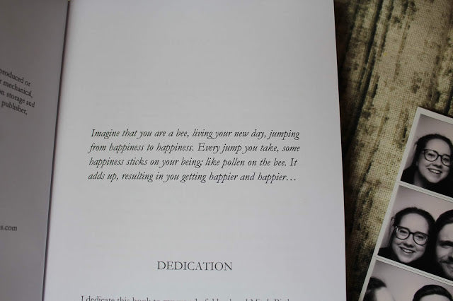 Interior pages of 365 Days of Happiness showing daily passages layout