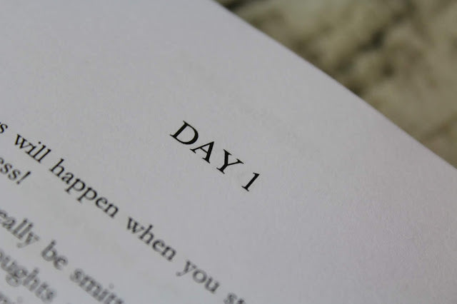 Interior pages of 365 Days of Happiness showing daily passages layout