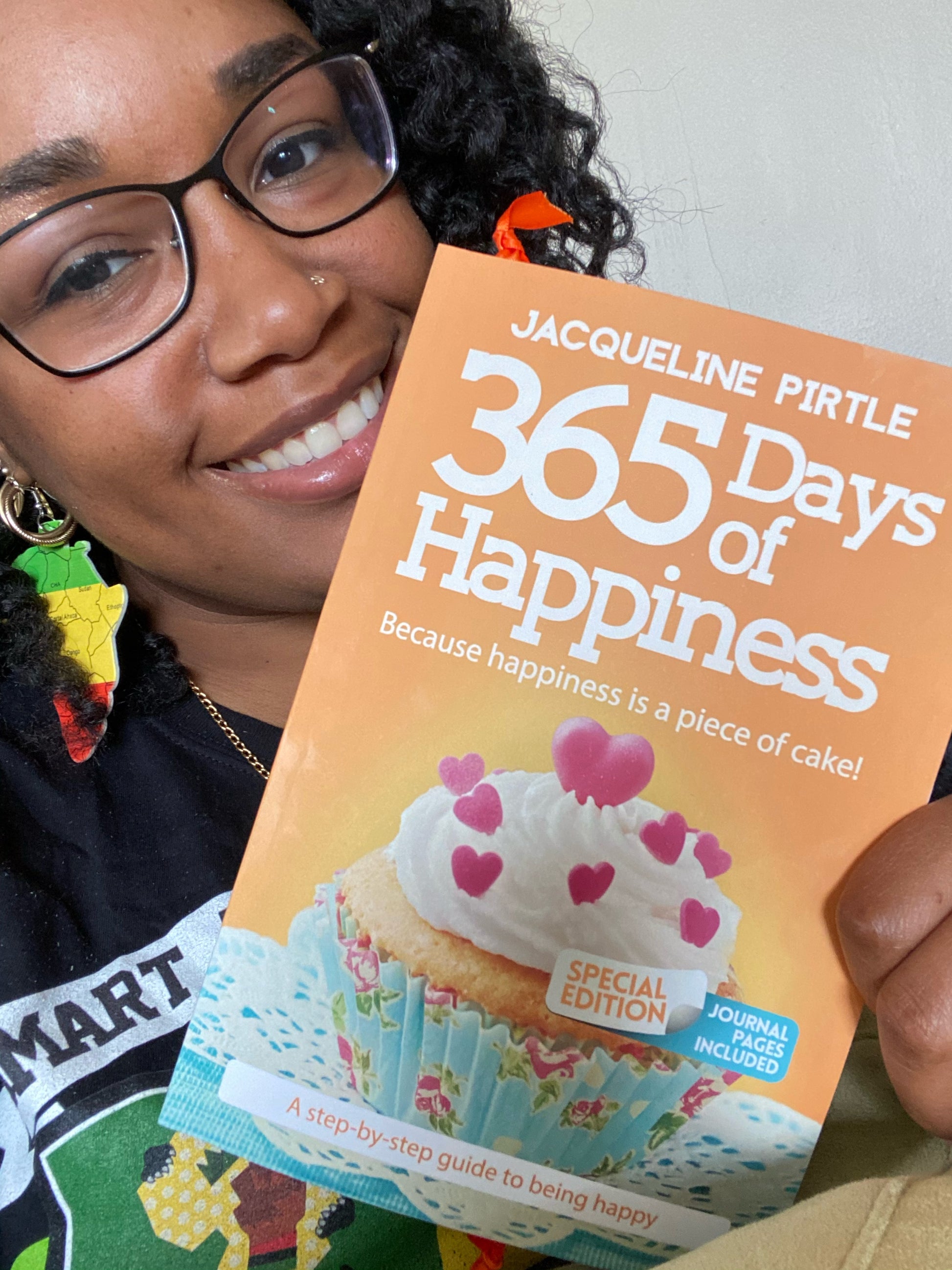365 Days of Happiness Special Edition book held by happy reader, woman smiling.